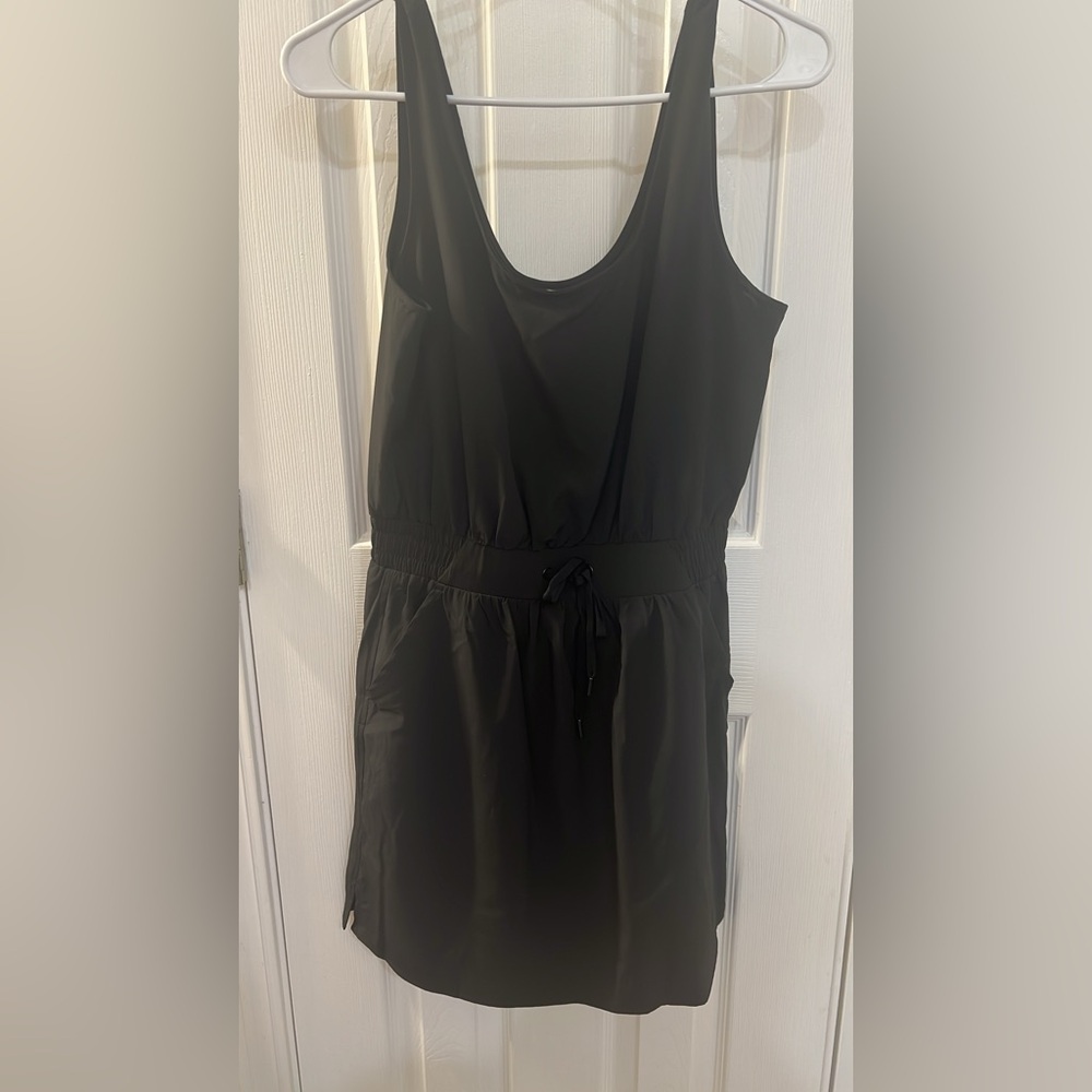 Calia. Never worn. Size small. Tie waist band, pockets. Athletic dress